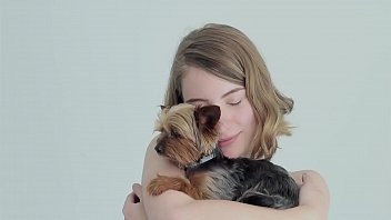 Play Hot naked blonde cuddling her puppy