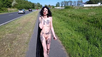 Play Slut Lucy Ravenblood walking nude at a public road